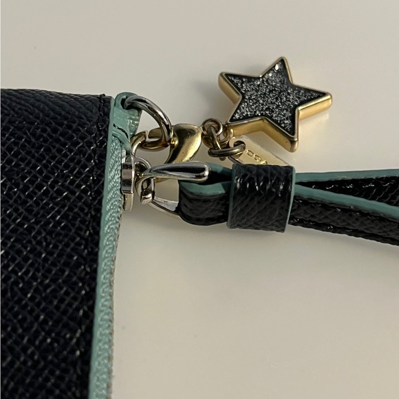 Stylish Coach wristlet in a deep dark blue color with a sleek design. - Picture 6 of 7